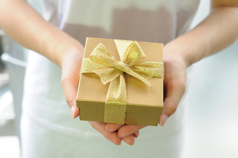 gift box held on woman hand